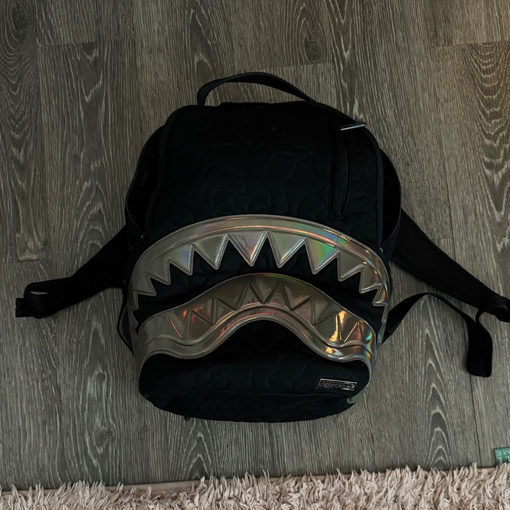 black and chrome sprayground backpack